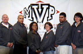 MVP Staff Photo in front of MVP banner